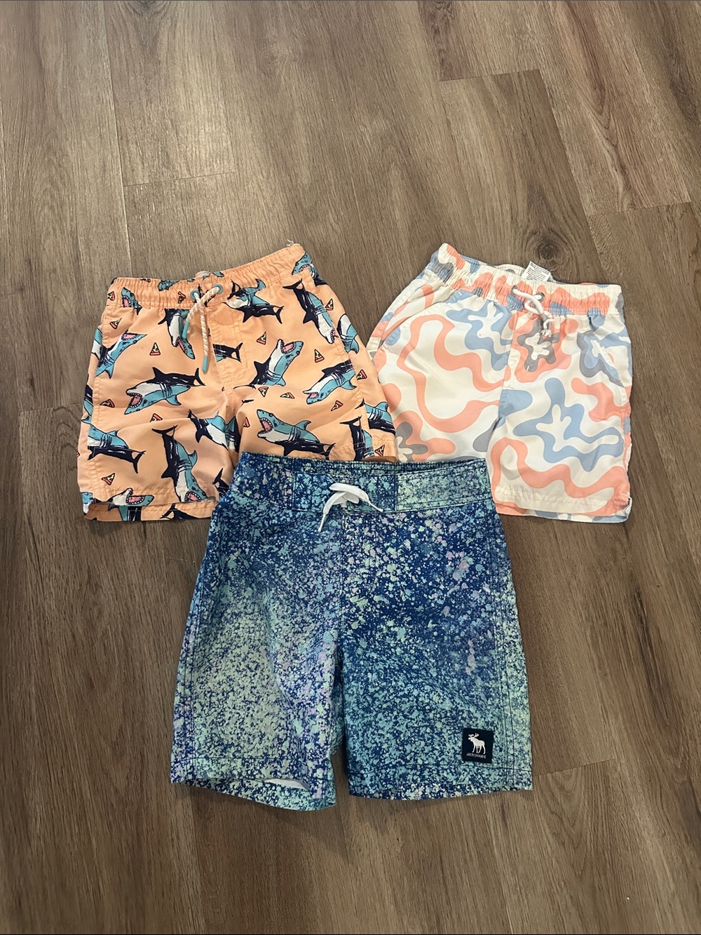 Cat & Jack Peach Shark, Peach-Blue Wave & Blue Speckle Swim Trunks - 3 Pack